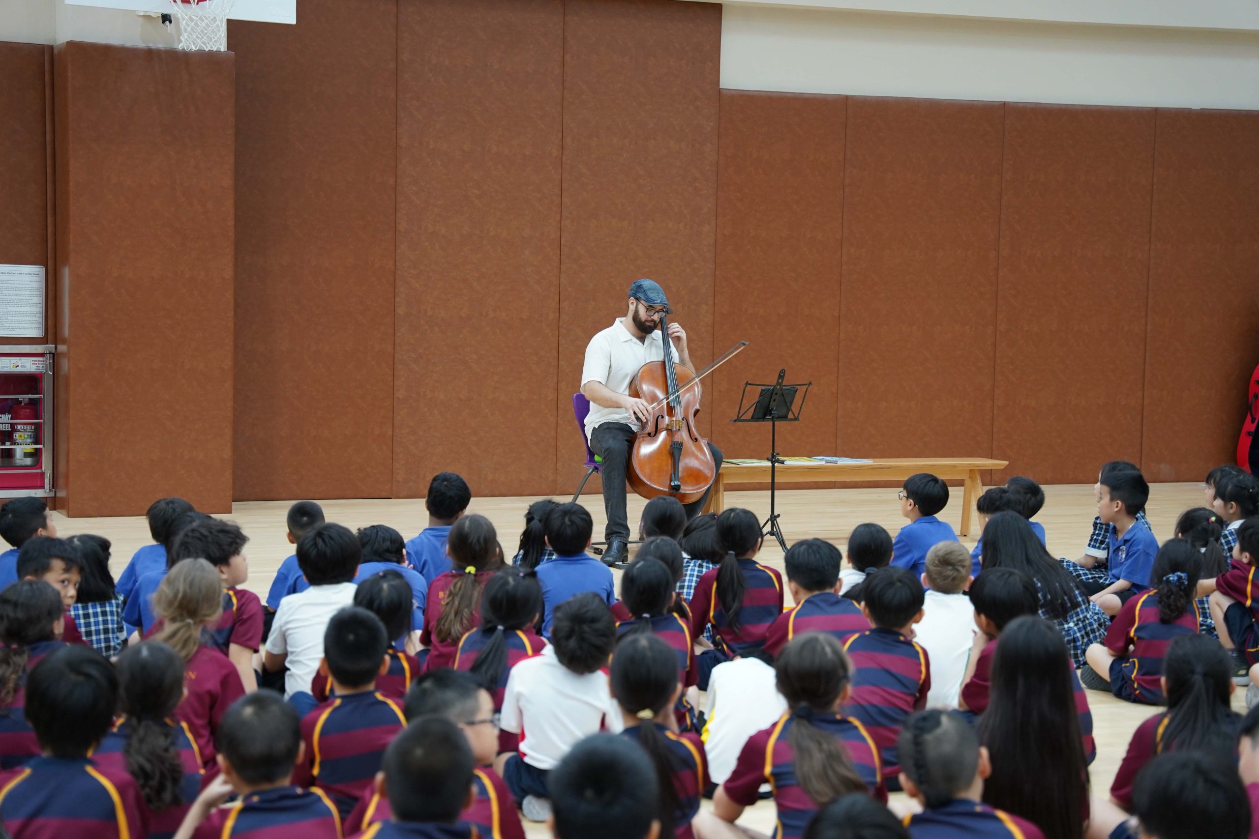 The pupils listened intently as traditional Vietnamese melodies harmonious blend with the rich tones of cello